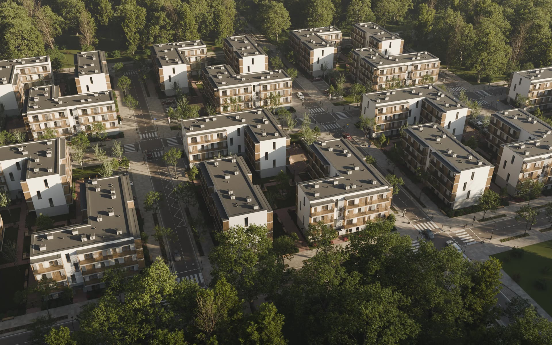 Aerial view of the three residential buildings and their courtyard among tree-lined streets